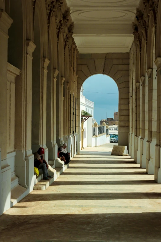 the walkway is covered by columns with the same pattern