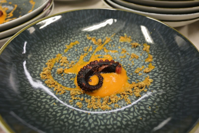 dessert is shown on an elaborate plate in a display