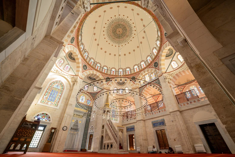 a beautiful room filled with stained glass and windows