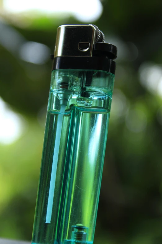 the inside of a clear glass tube with a black cap