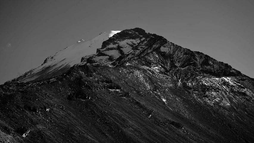 a black and white po of a mountain peak