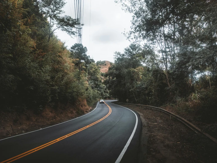 a curve in the road with no car on it