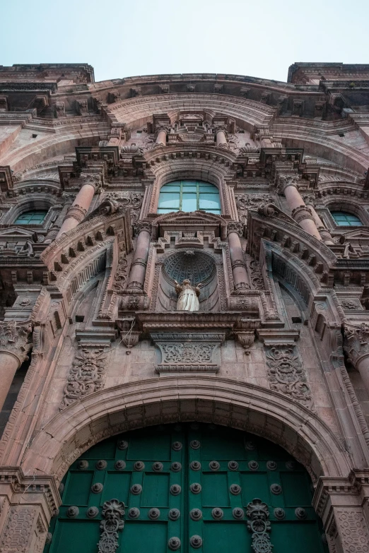 the front view of a large building with lots of windows