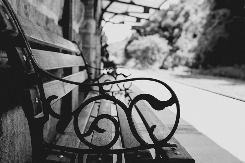 a black and white po of an outside bench