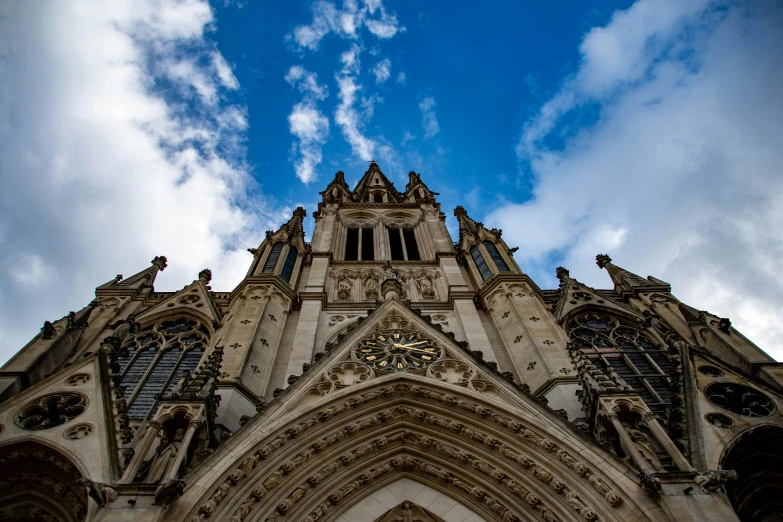 the tower of a building that looks like an old cathedral