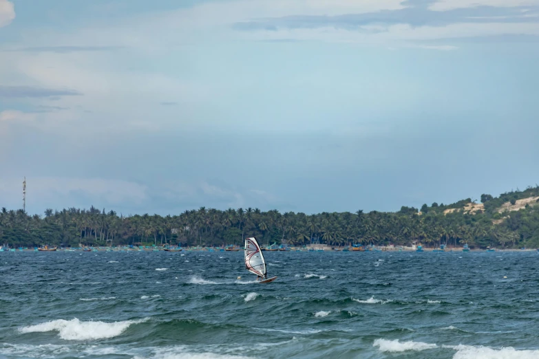 two boats are in the ocean on a sunny day