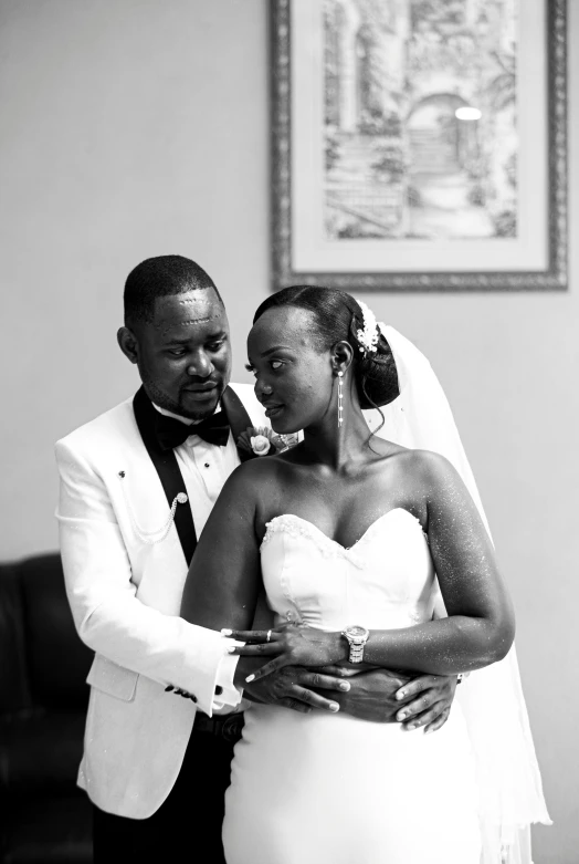 a bride and groom standing close together