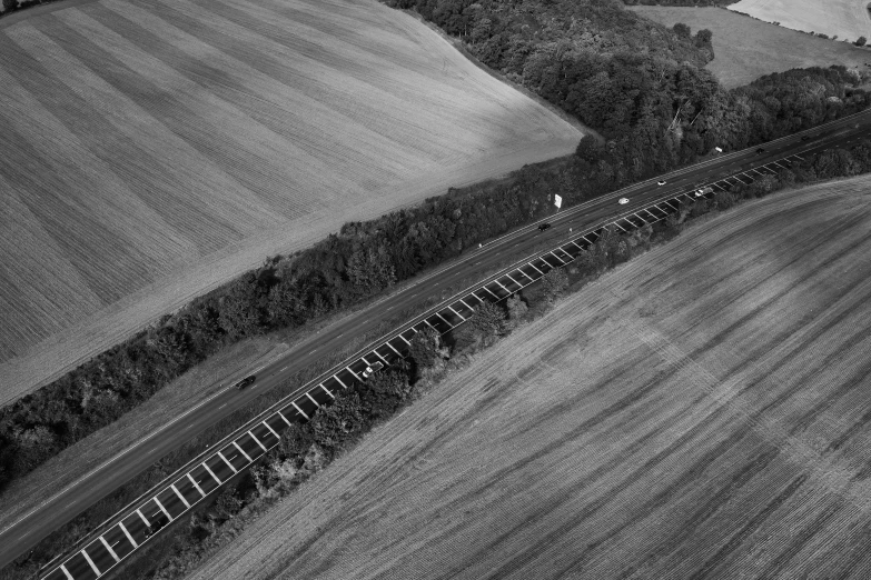 an overhead s of a train coming out of the tunnel