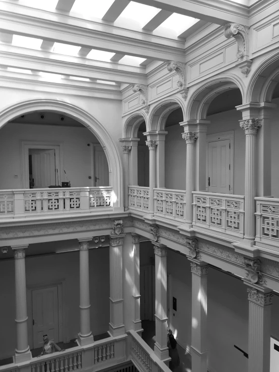 large open building with ceiling beams and multiple stories