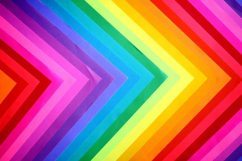 an abstract rainbow background is painted with different colors