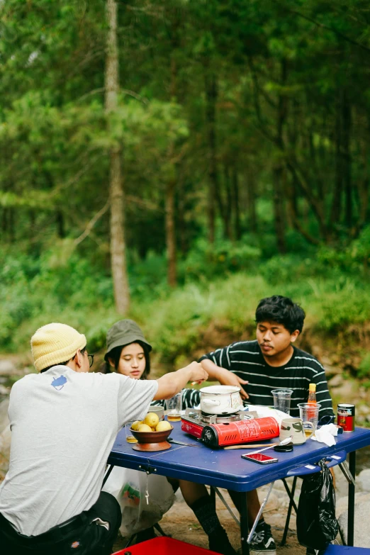 two people sitting at a picnic table