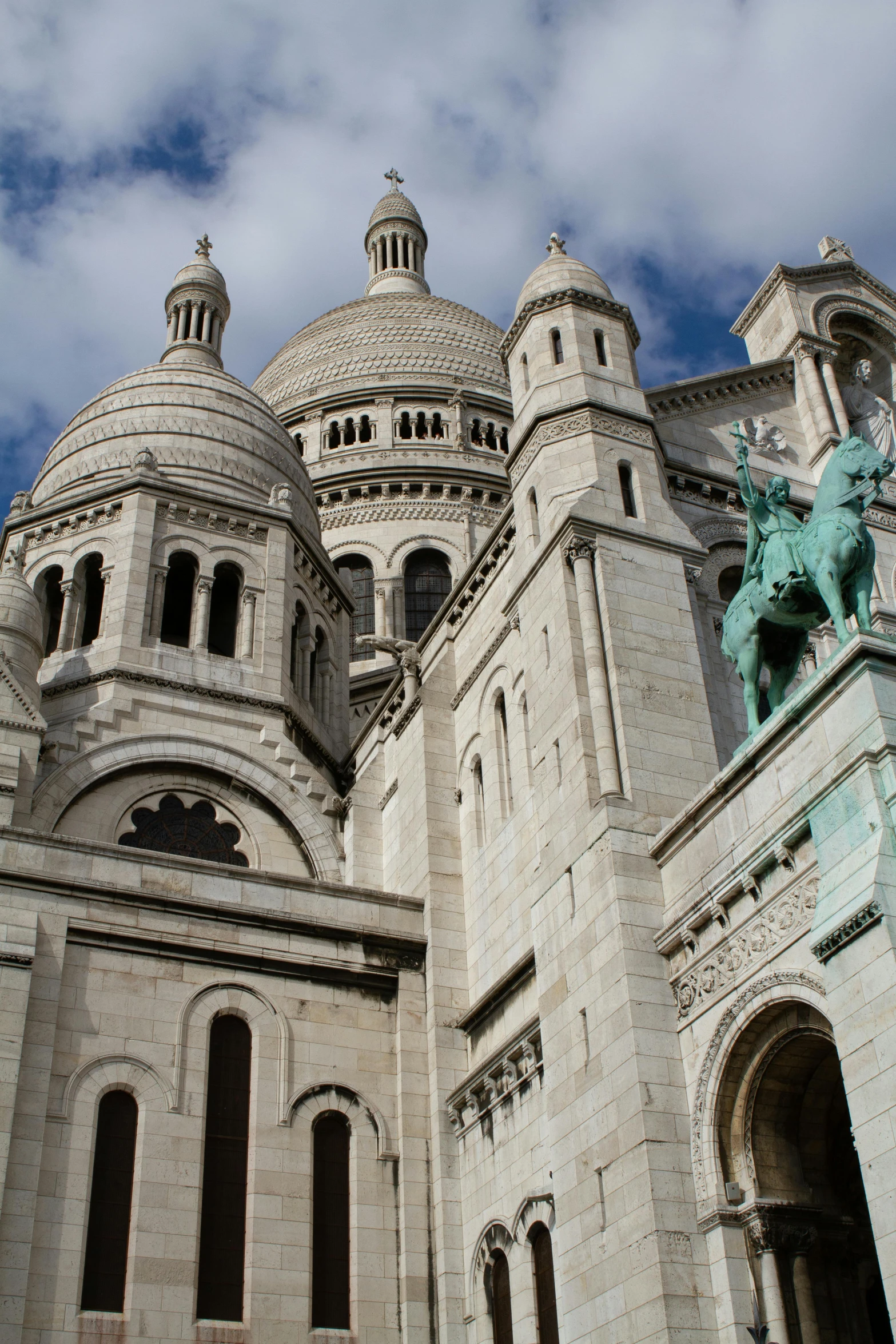 a large castle with a statue on the outside of it