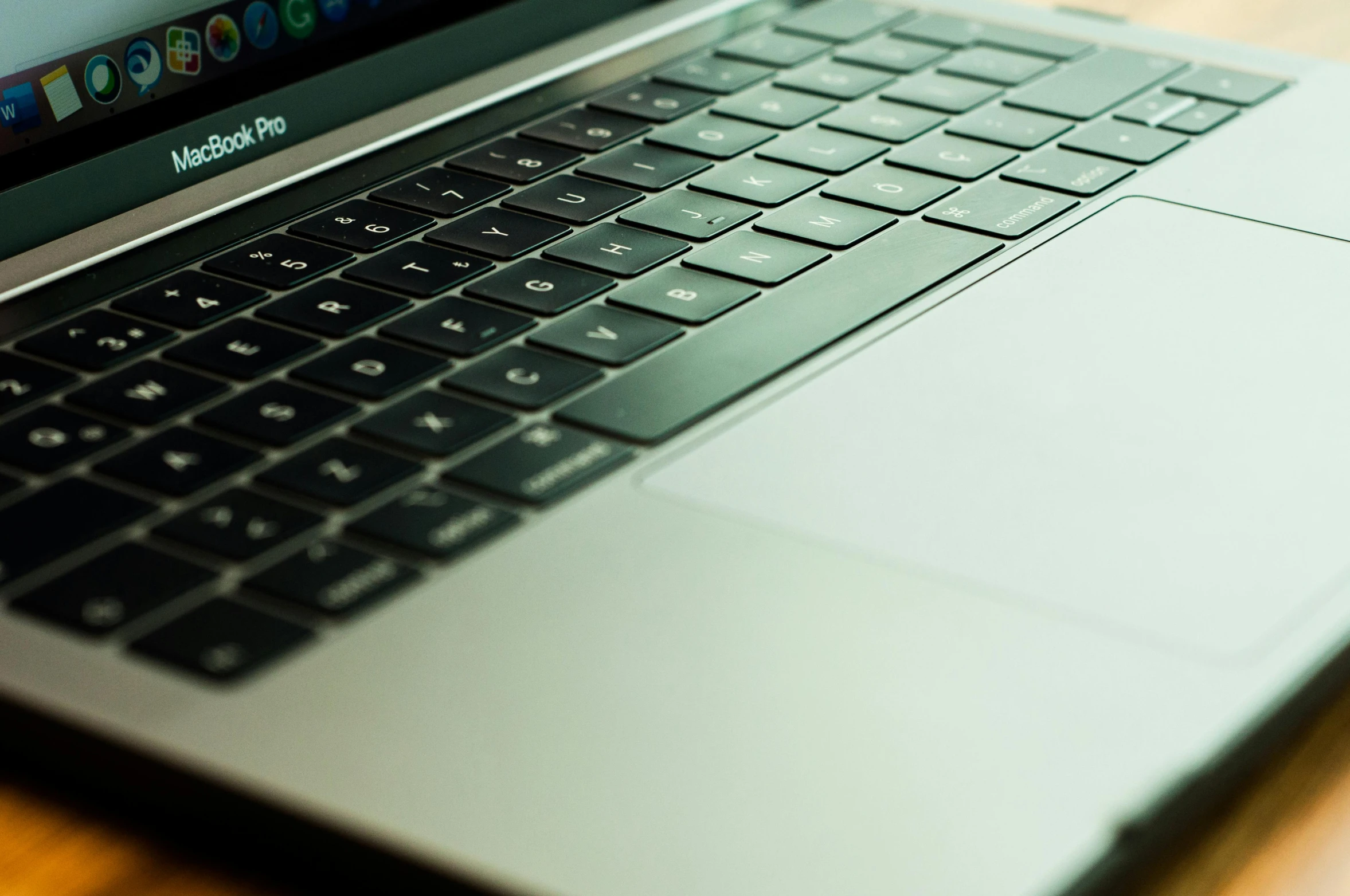 the keyboard of a silver laptop computer