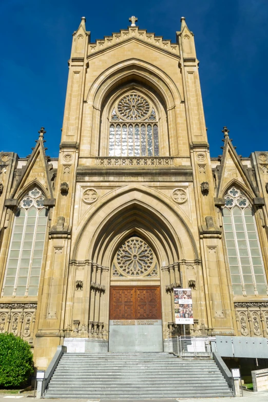 a very tall church with many stairs leading up to it