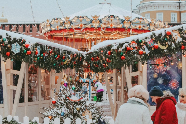 a carousel has many christmas decorations around it