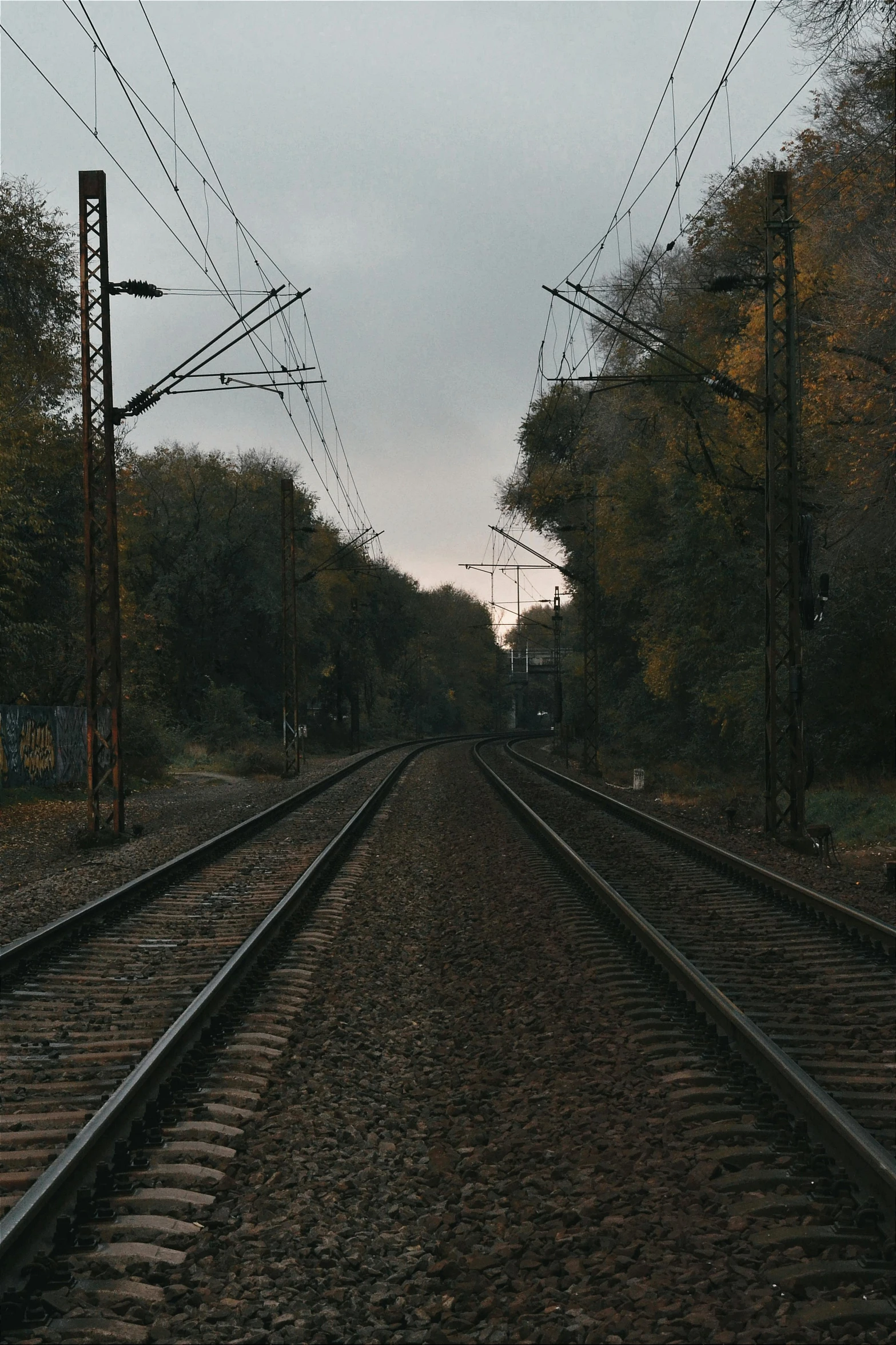 the train tracks are empty during this beautiful, autumn day