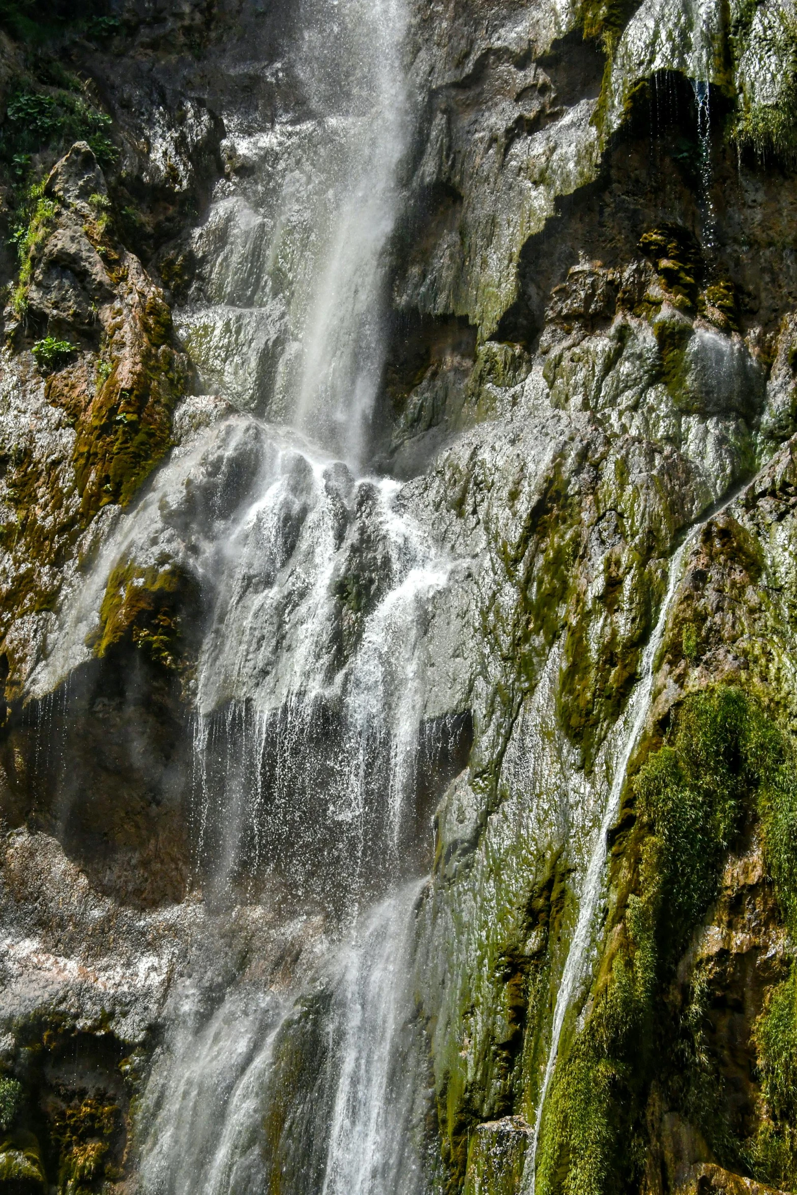 a waterfall with lots of water flowing over it