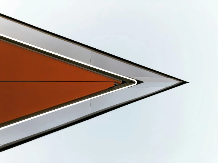 the red triangle is being reflected in the glass