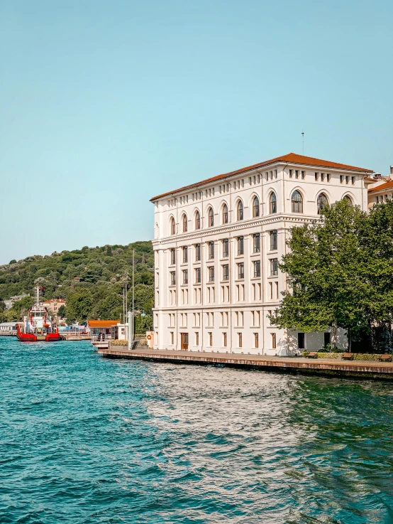 the building in the water is near trees