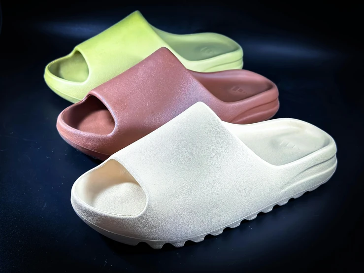 a pair of slippers are shown with different colors