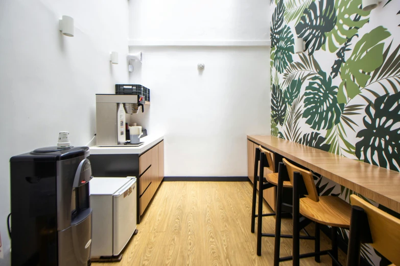 a clean kitchen with tables and a counter