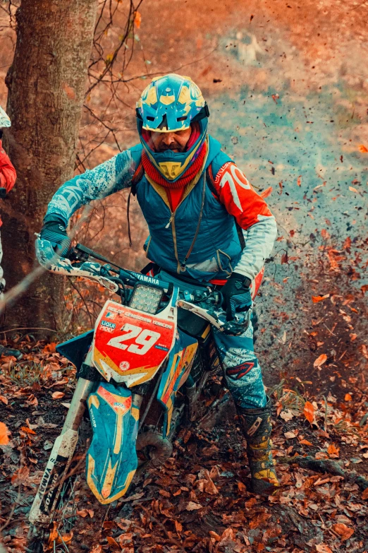 an image of a motorcyclist that is going through some mud