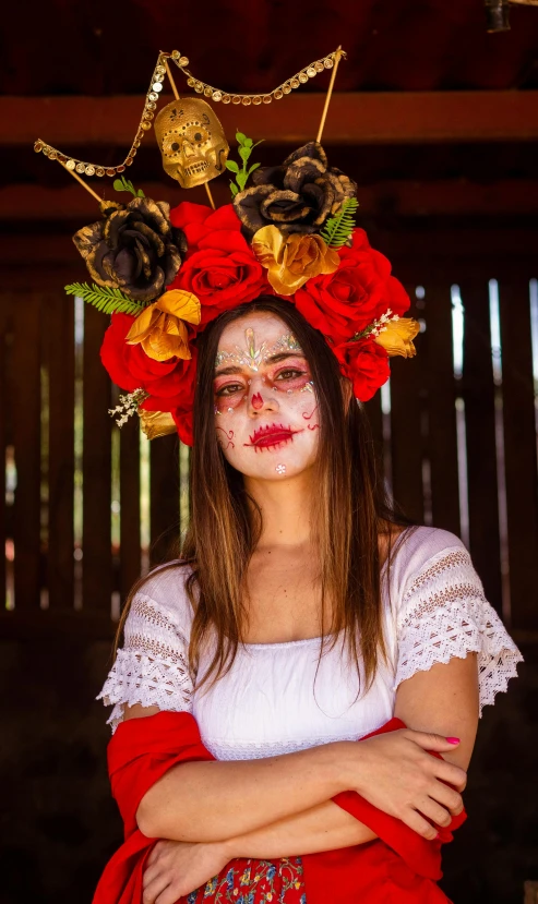 a woman is wearing a flower crown on her head