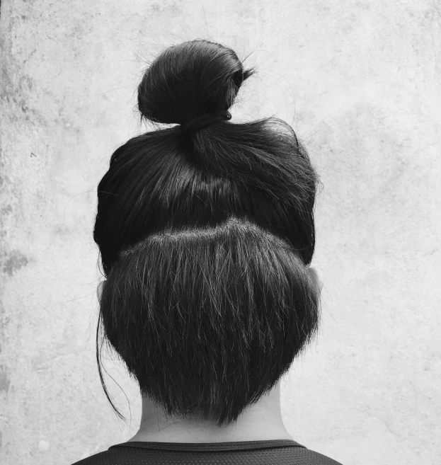a woman with a bun hair and buns