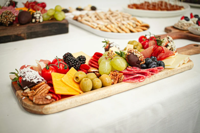 the platters have fruit on them on top of a table