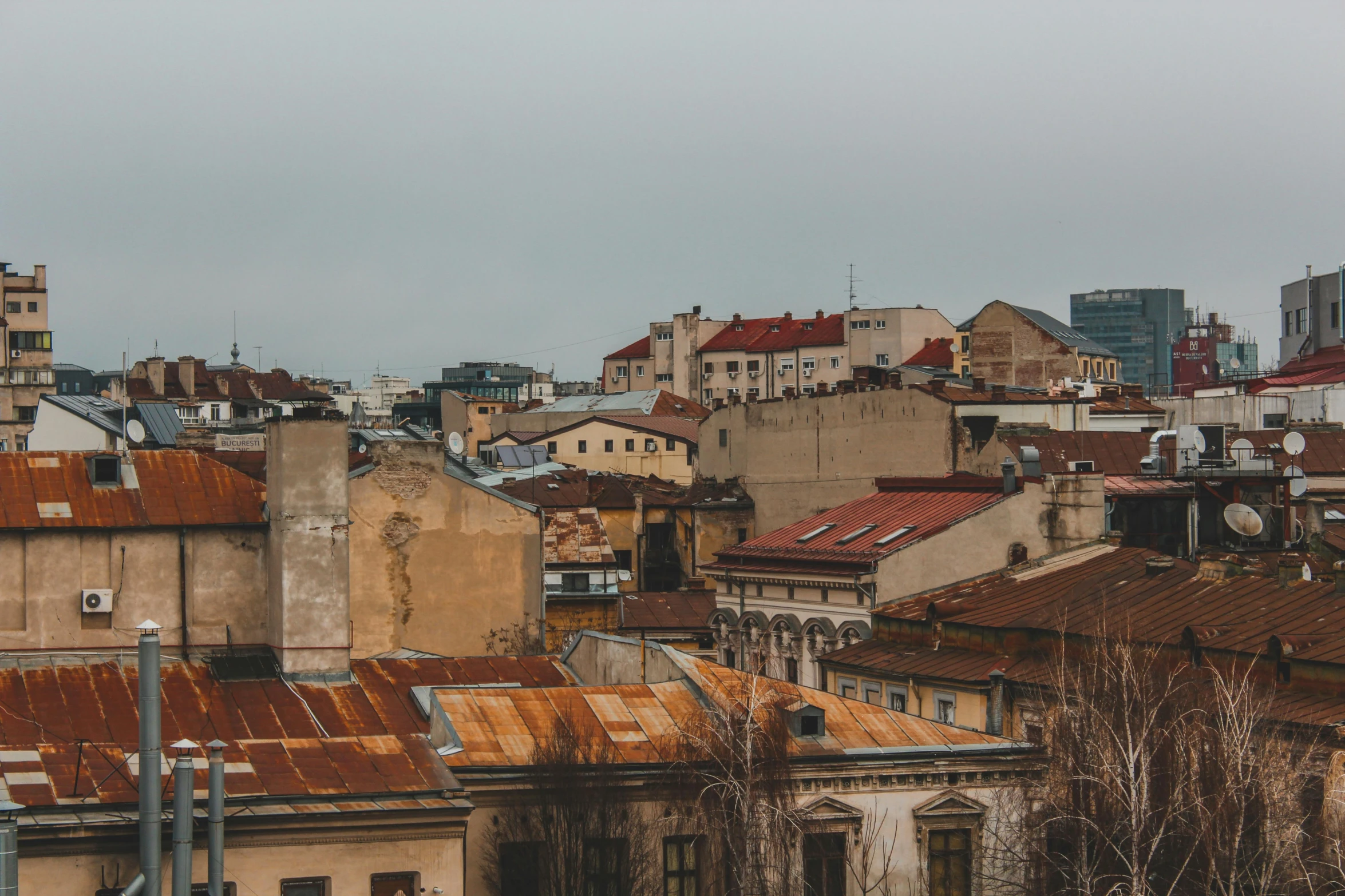 the roofs and buildings of several large cities