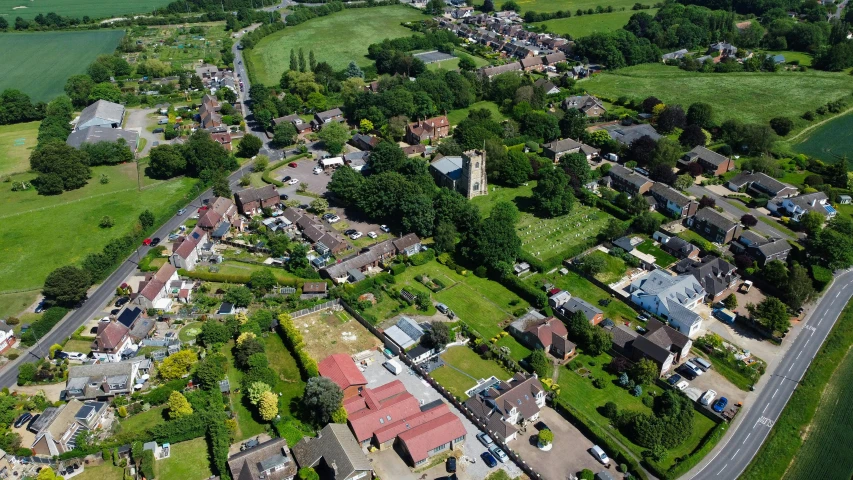 a bird's eye view of an area of green with several buildings