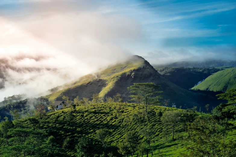 clouds moving by the top of the mountain