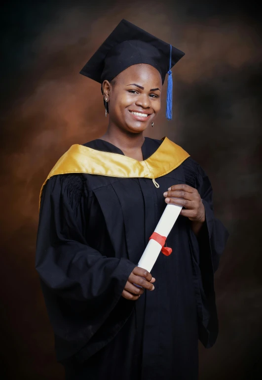 a woman in a graduation gown posing for a po