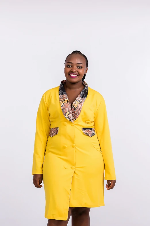 woman in yellow coat standing with white background