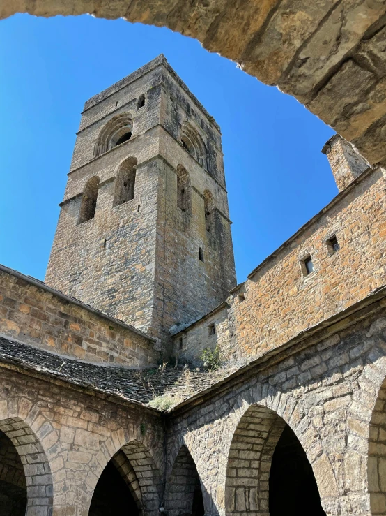 looking up at an ancient stone tower