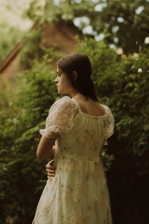 a woman standing with her back to the camera