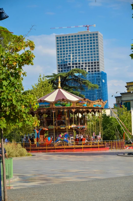 there is a carousel in the middle of a street