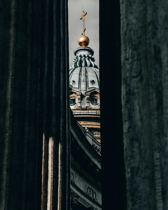 the view through some curtains looking up at the dome of a building