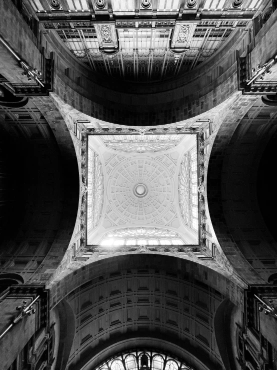 a cathedral roof has a metal and glass design