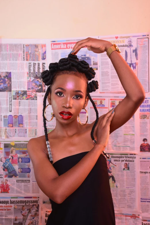 a woman in front of a newspaper is putting on lipstick