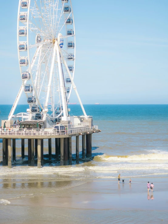 large ferris wheel over the ocean at beach