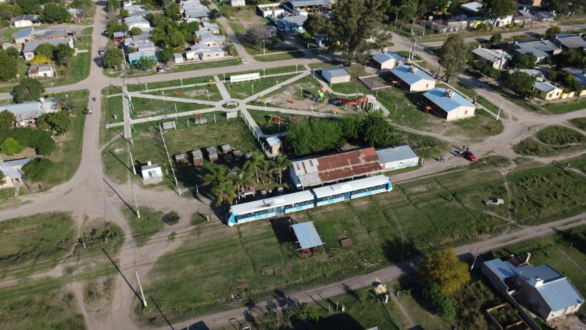 aerial view of a vacant lot near a community in rural area