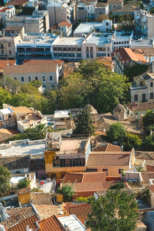 a beautiful aerial view of a city with red rooftops