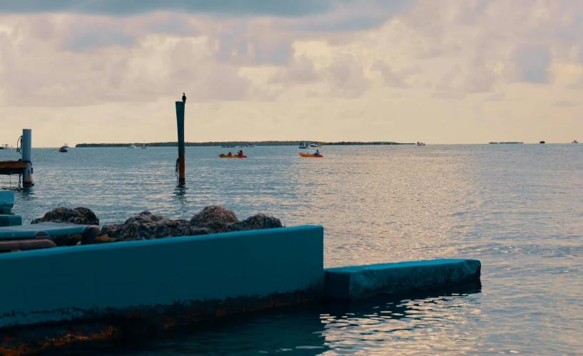 boats in the ocean with a sky background