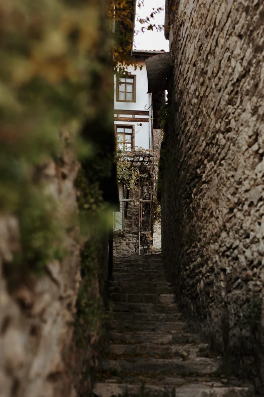 looking down the street through a small stone building