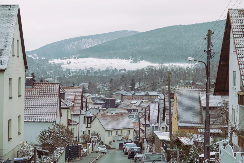 a scenic view of small town and mountains