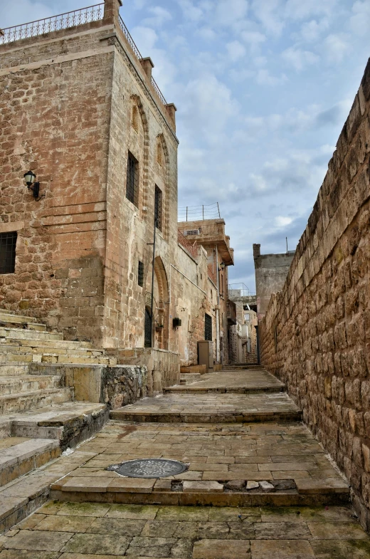 a stone block alleyway in an old european country