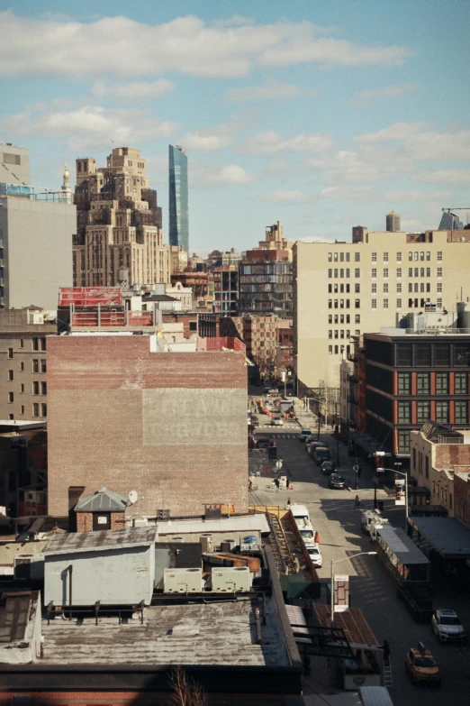 looking down at a city street from an upper floor window