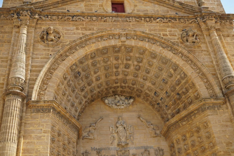 there is a tall church with arched doorways