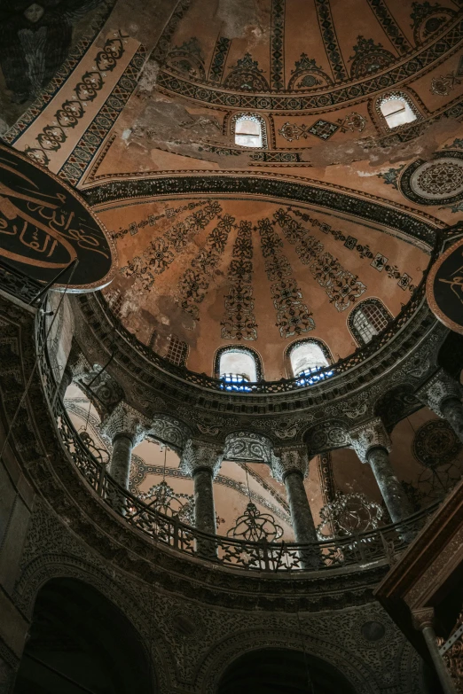 the ceiling of an ornate, mosaiced building